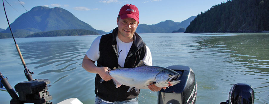 Handsome fisherman with fish